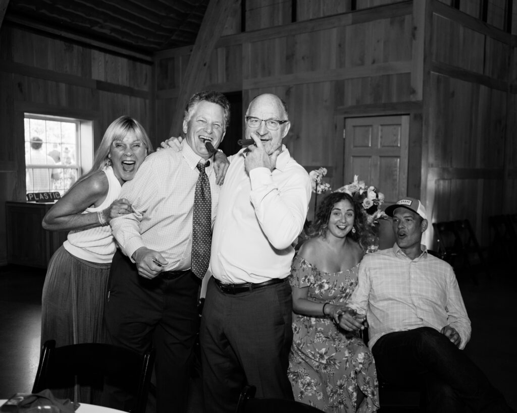 Family pose for a photo at a wedding