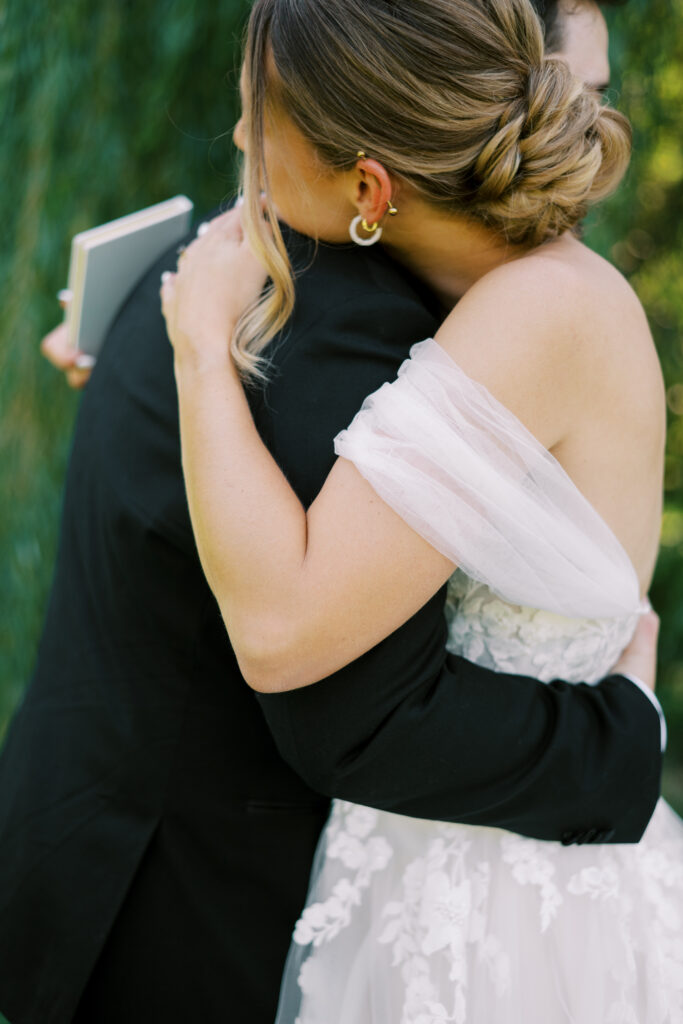 bride and groom hug on wedding day