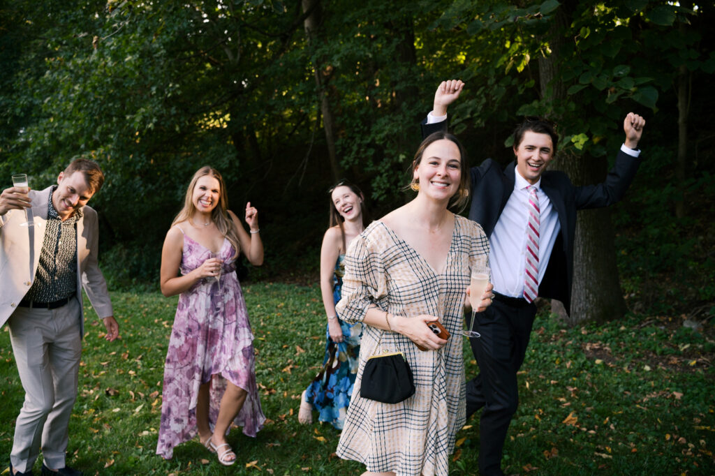 Guests cheering at wedding