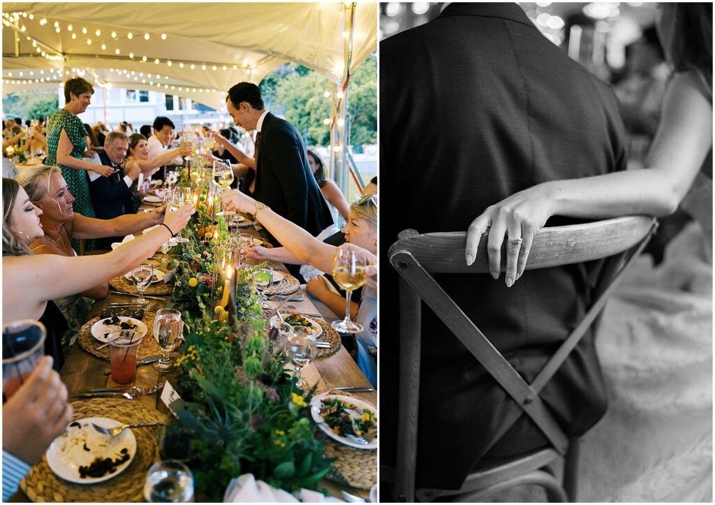 A bride puts her arm around the back of a groom's chair in a candid wedding photo.