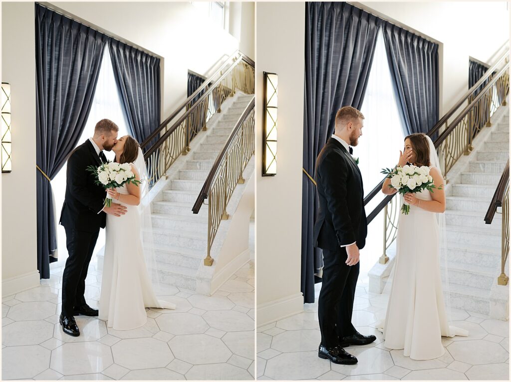 A bride and groom kiss at their first look in the lobby of Hotel Blackhawk.