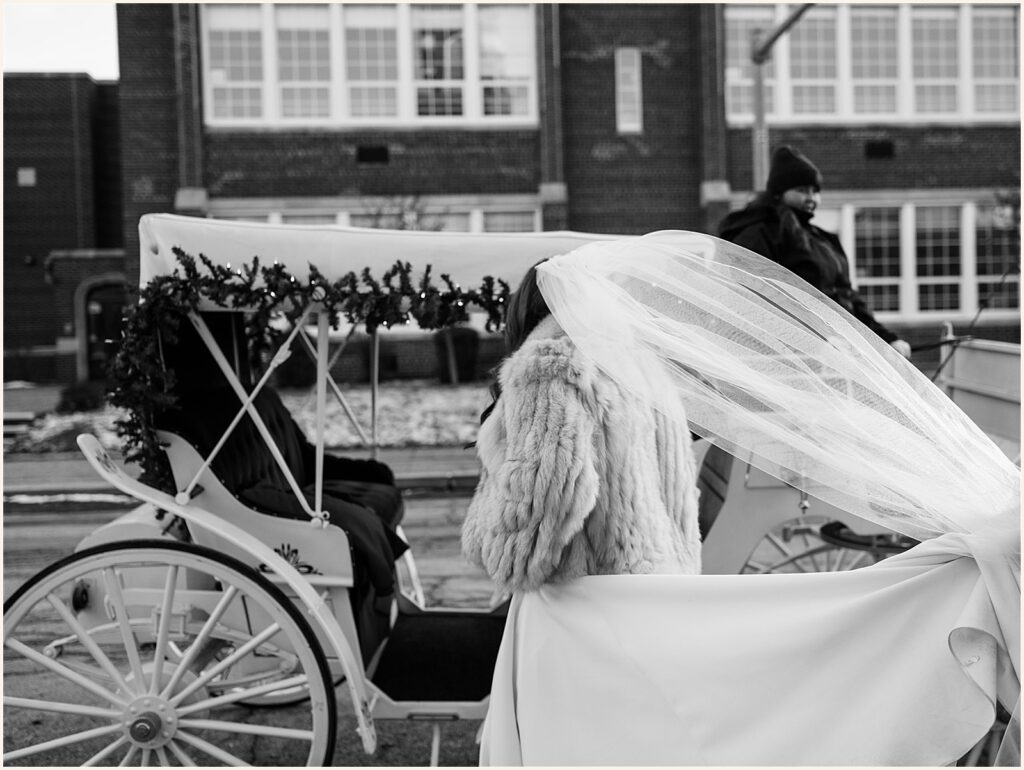 A bride climbs into a carriage.