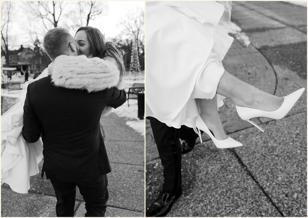 A groom picks up a bride for a kiss on a Davenport sidewalk.
