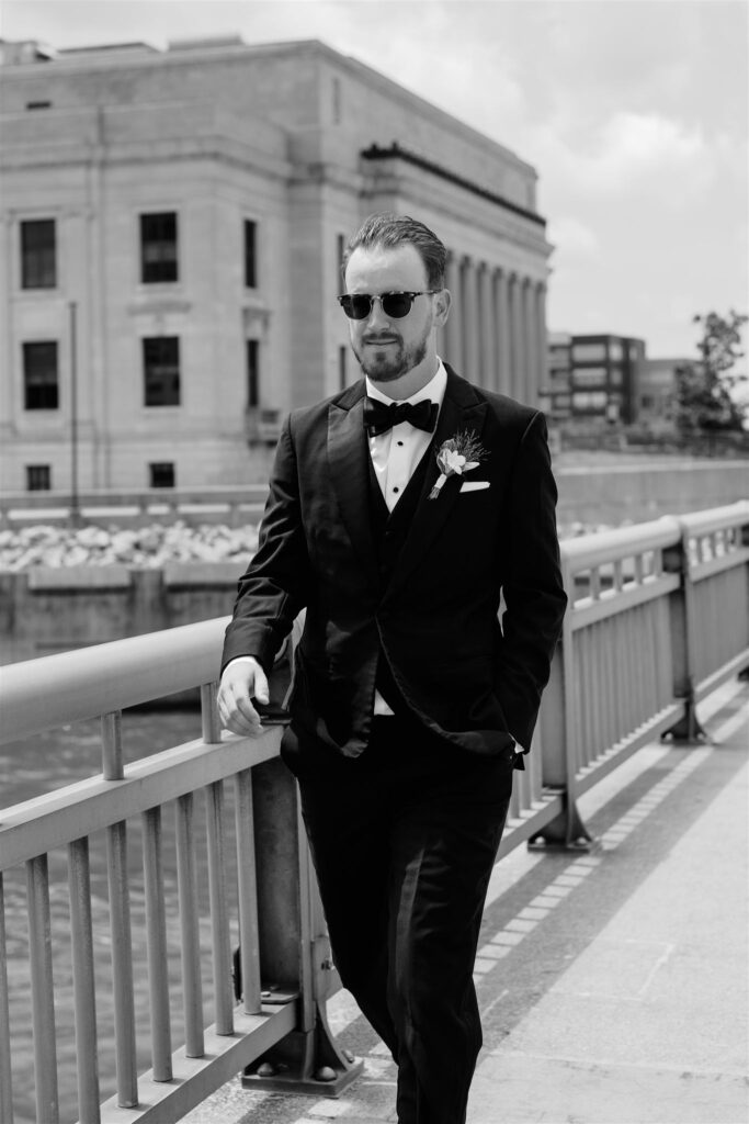 groom walking at eastbank venue cedar rapids