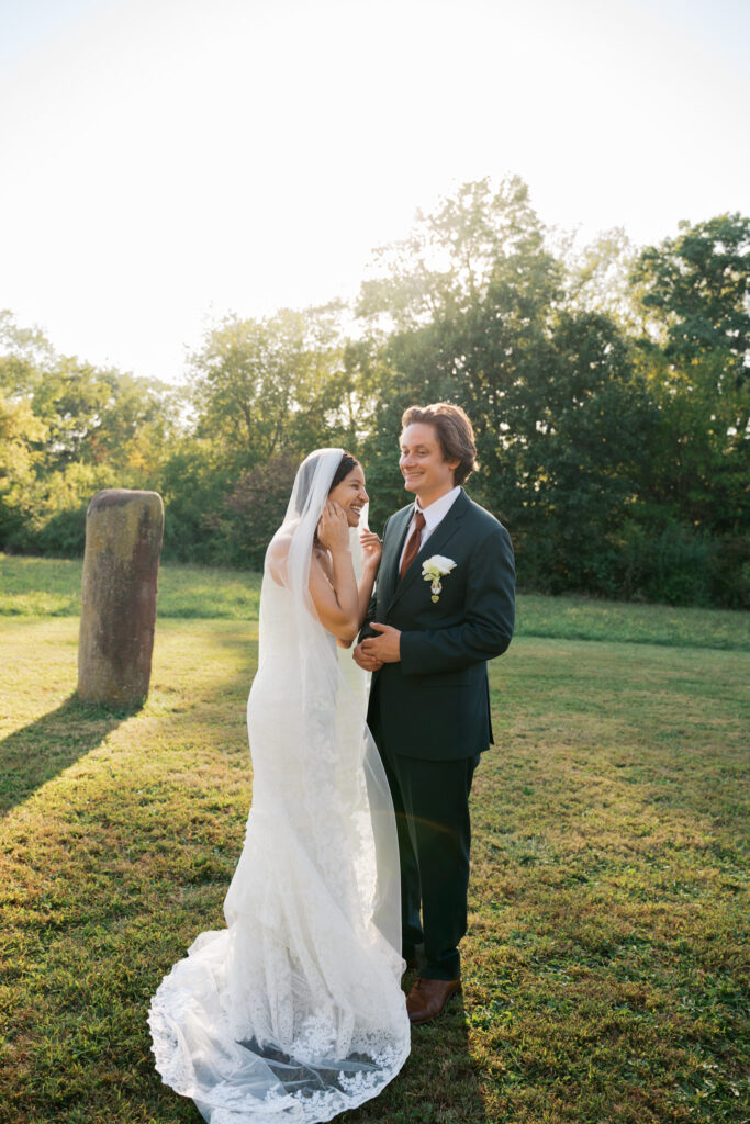 Couple sharing a joyful outdoors moment, captured in natural storytelling form with a documentary style wedding photographer