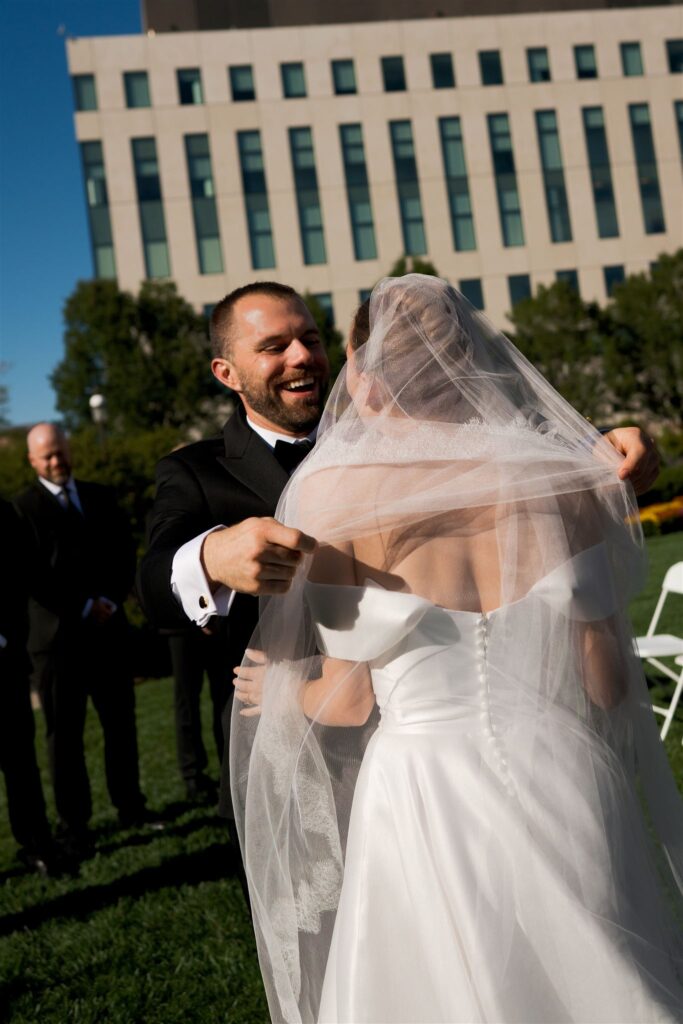 Bride and groom say I do in outdoor ceremony in genuine documentary style photography wedding moment
