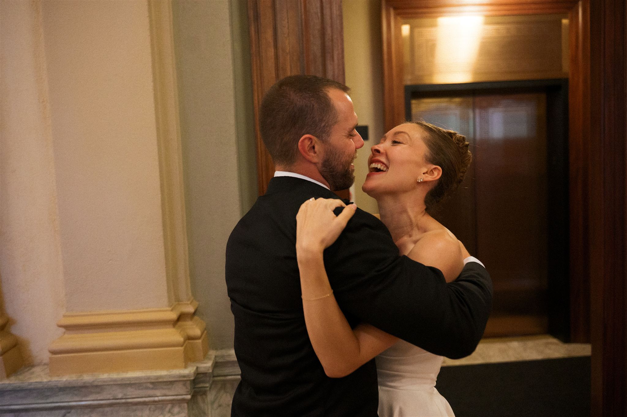 Couple embracing after their ceremony in intimate documentary style wedding photography moment