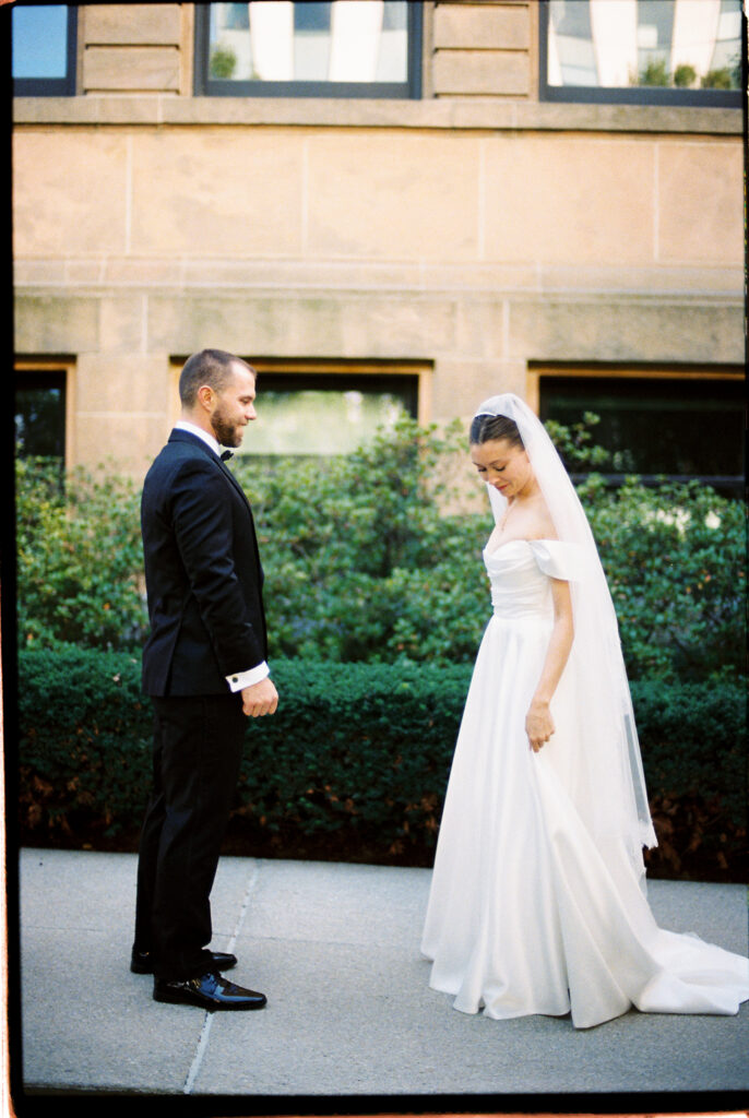 Film image of bride and groom seeing eachother